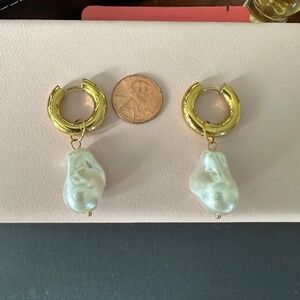 Gold tone and pearl hoop earrings